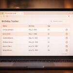 A bright London café workspace showing a MacBook with a light-themed Flask code editor open to CS50x Week 9 Finance routes and SQL portfolio queries, with warm natural daylight and a softly blurred London street through the window.